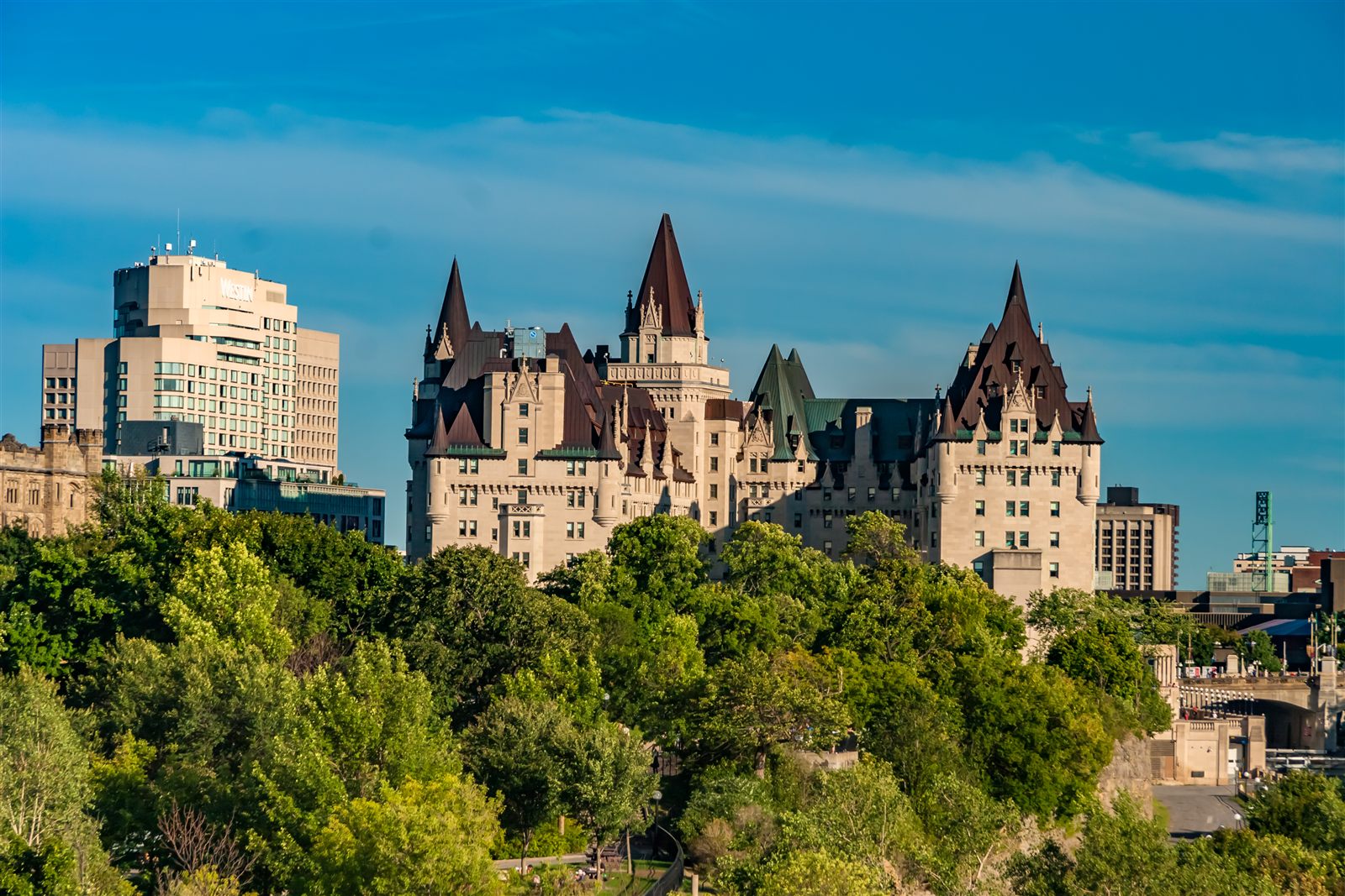 A limestone château hotel beside a canal in Ottawa